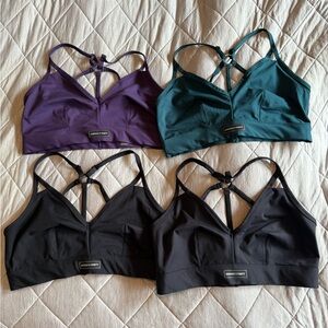 BNWOT set of 4 size 1x savagexfenty sports bras. 2 black, 1 purple, 1 dark green